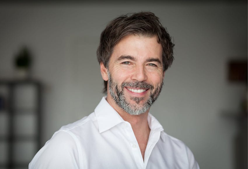 man in white shirt smiling