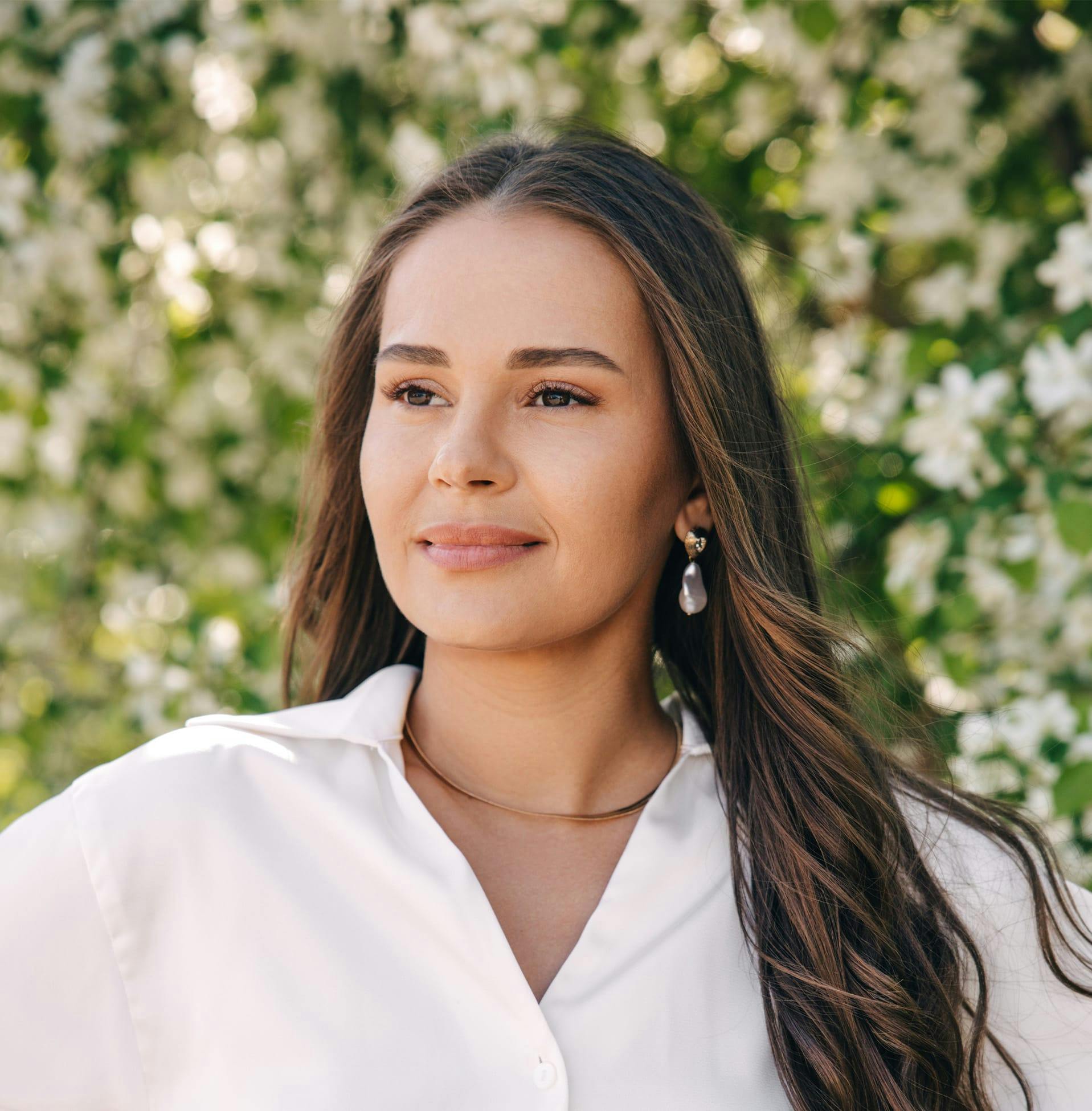 woman in front of flowers