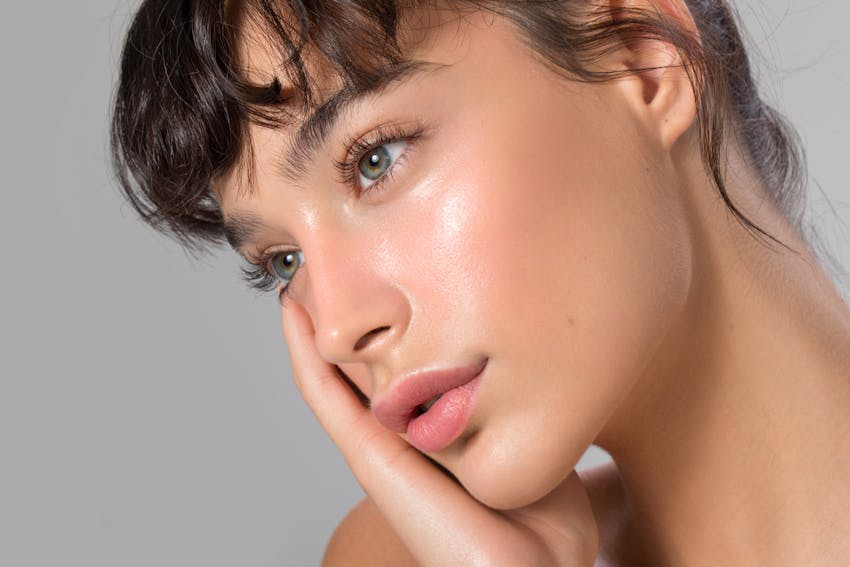 model with bangs looking off in the distance