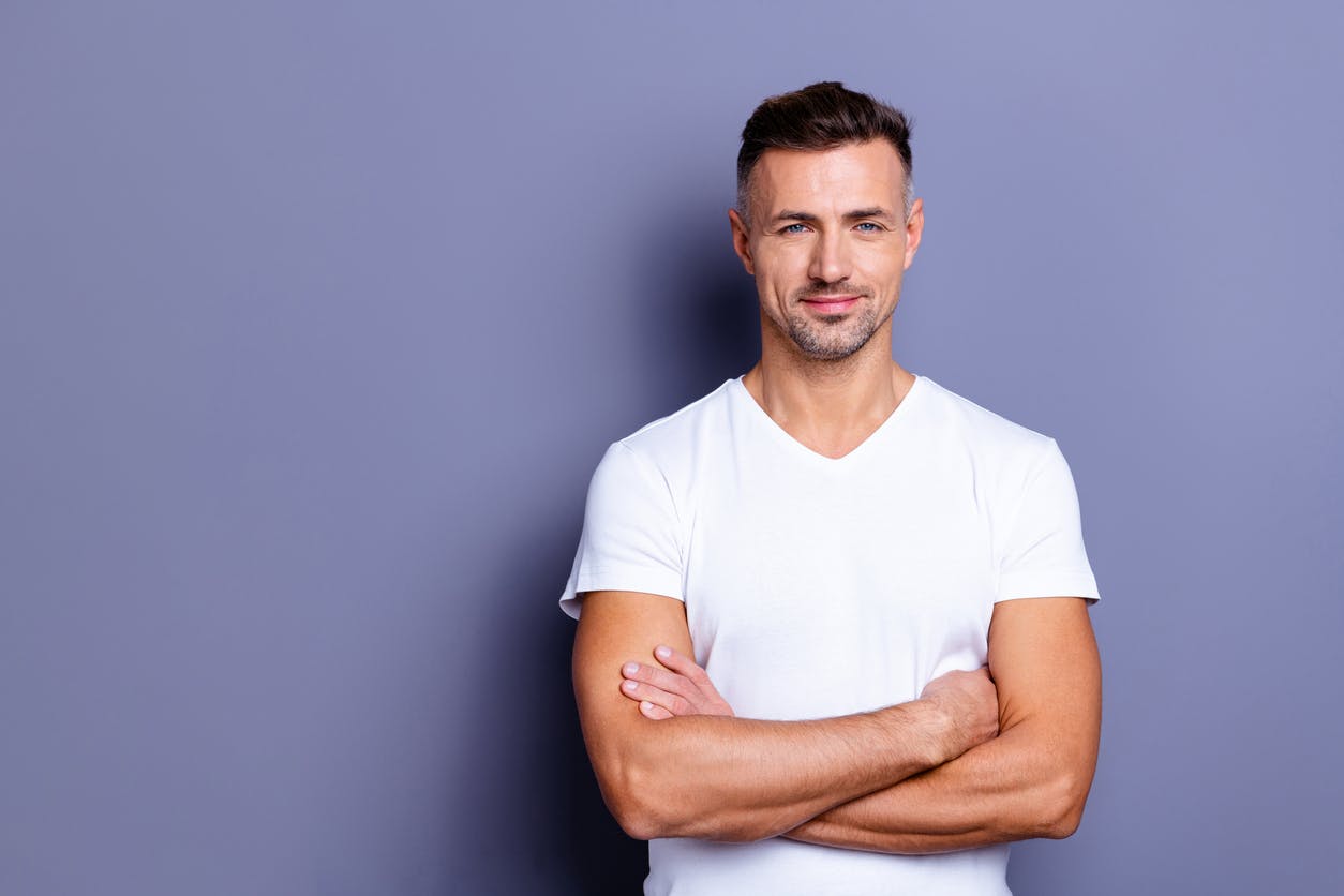 man standing in a white shirt