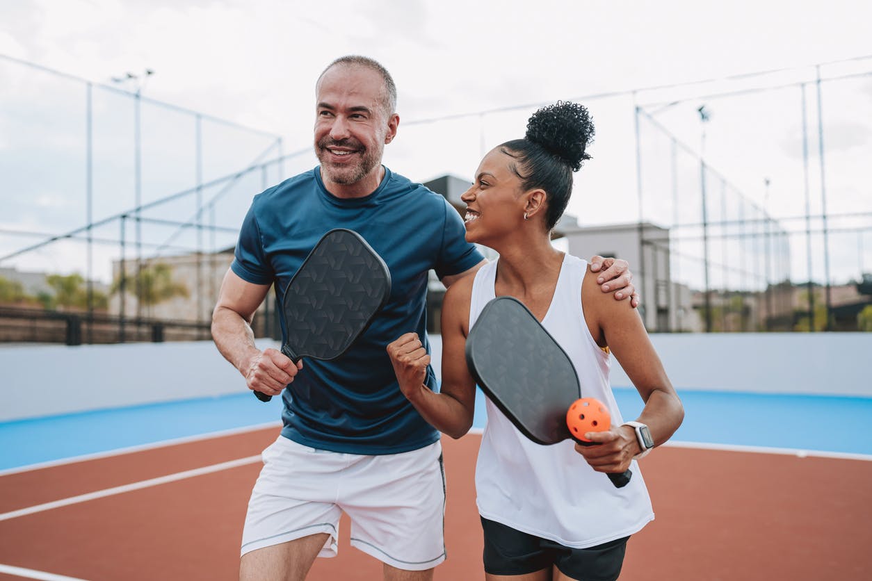 couple playing pickleball