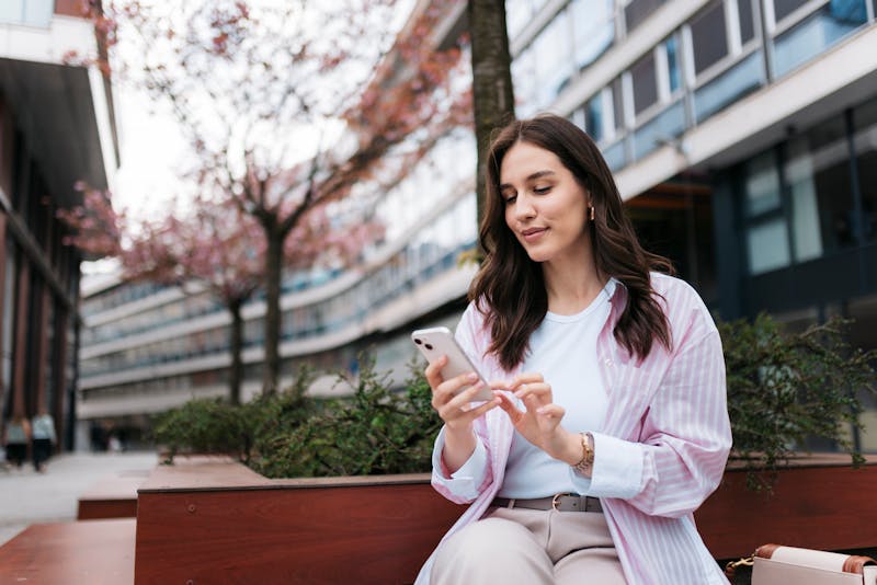 woman in pink and white linen shirt