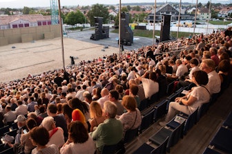 ictures of the rehearsals in front of the empty grandstand. On August 15, the grandstand was full with spectators.