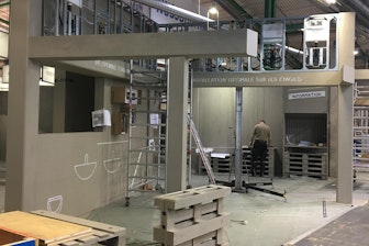 The trade fair booth stood out particularly due to ist special design in the construction site look and the shiny pipes