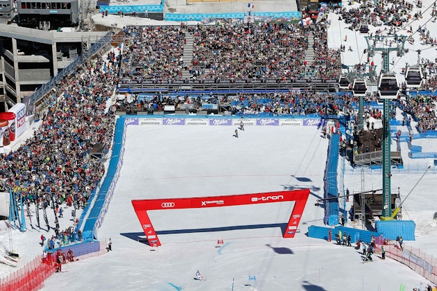 Spectator grandstands and other event structures in the finish area of the ski race.