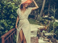 Woman with nice legs walking in a tropical environment.