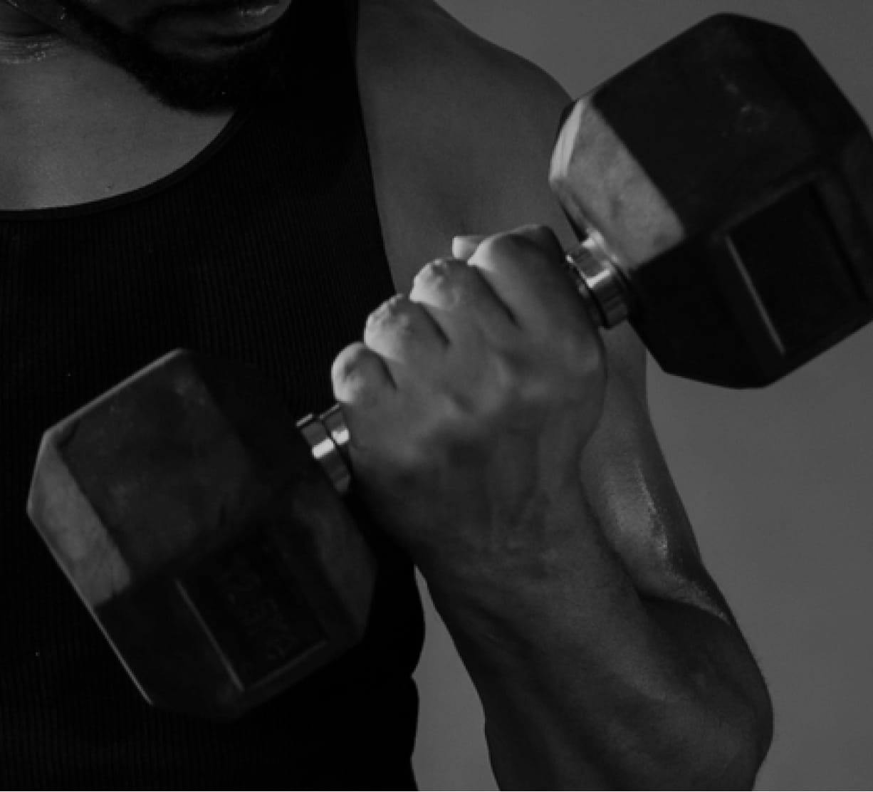 man holding dumbbell