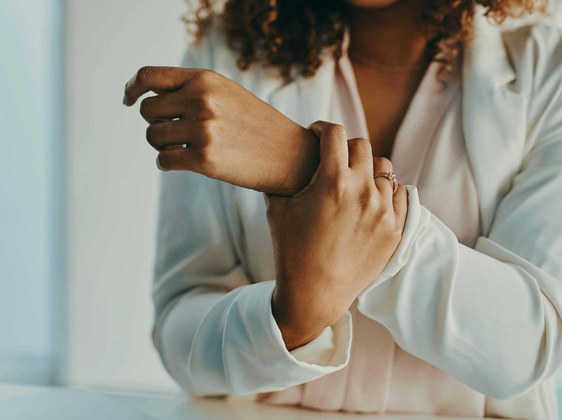 woman holding her wrist