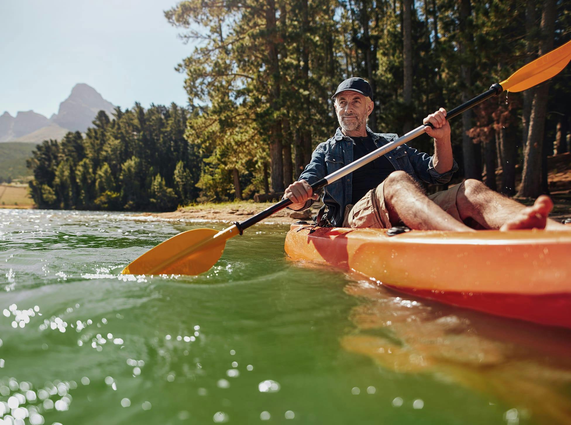 older man in a kayak