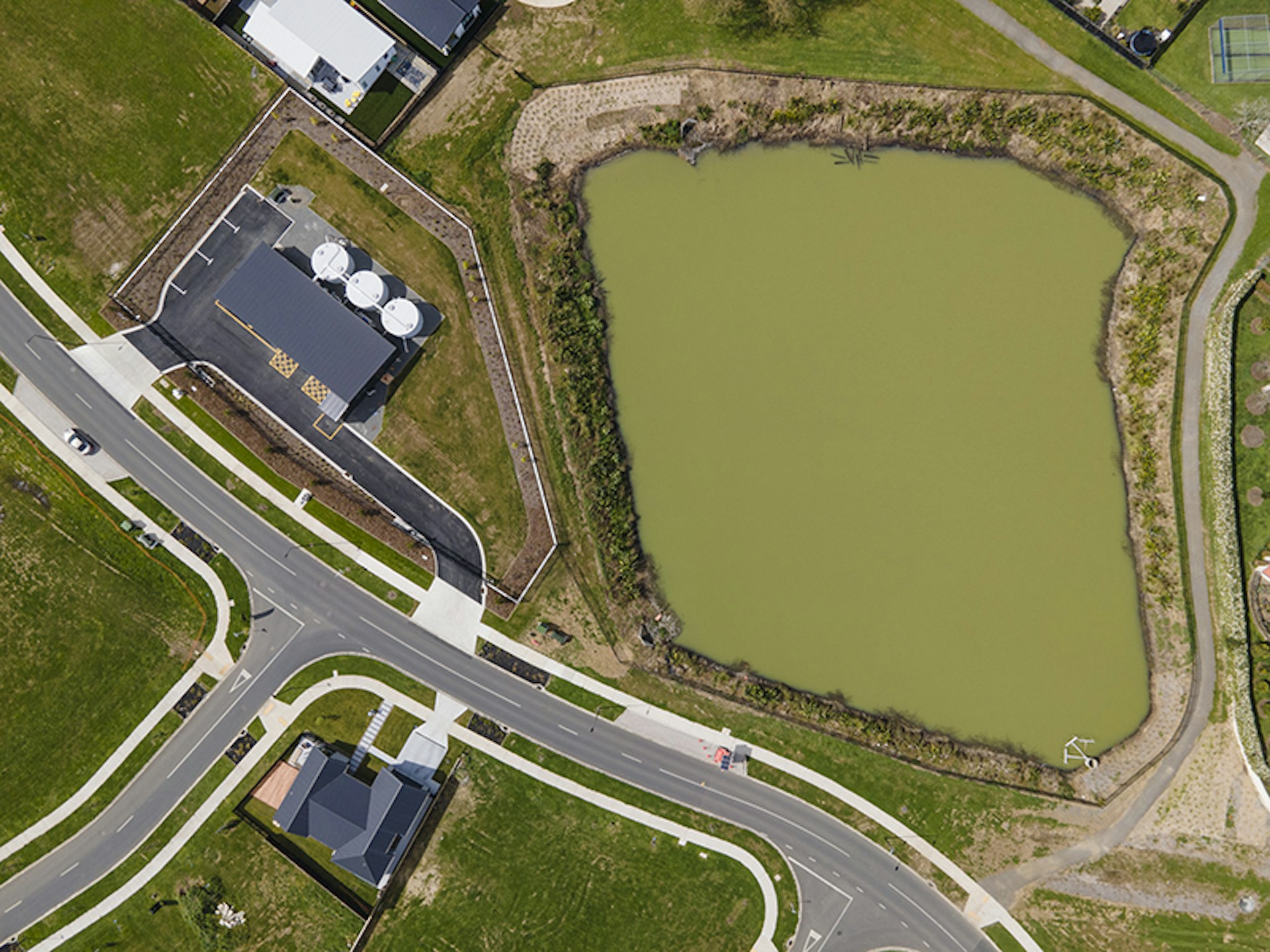 Top-down aerial view of the Lockerbie Water Treatment Plant and adjacent stormwater pond.