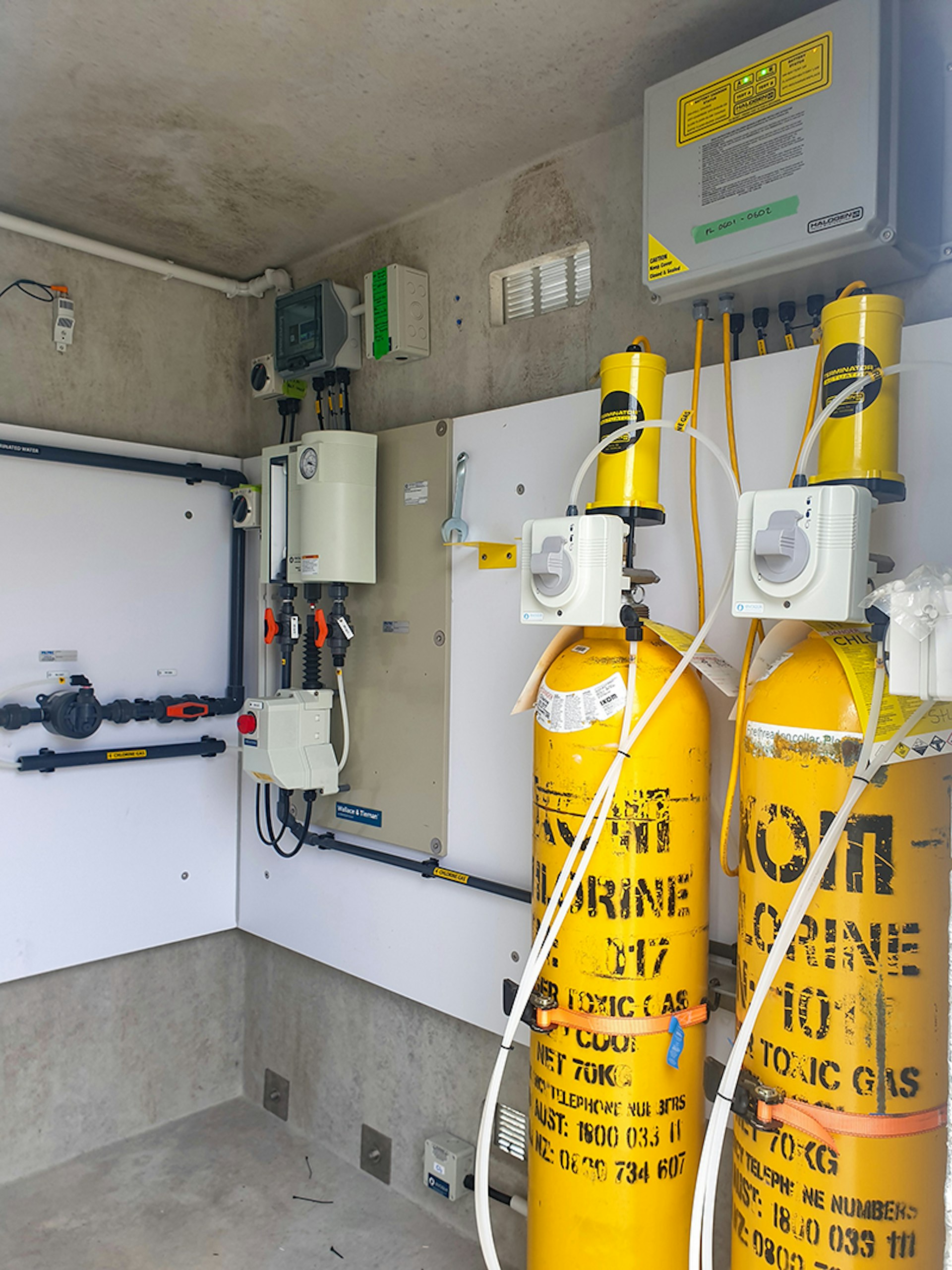 Chlorine gas cylinders and dosing controls at Roots Street treatment facility.