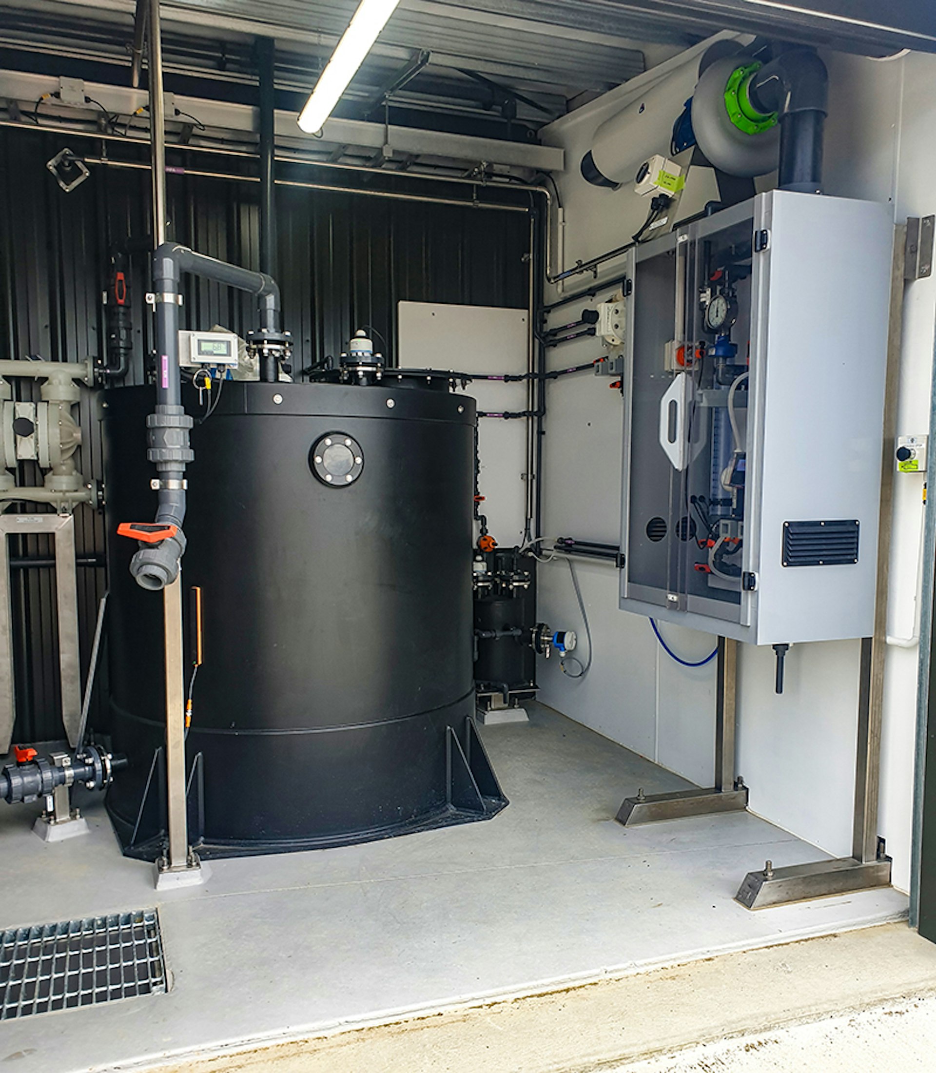 Chemical dosing system and storage tank inside the Roots Street treatment facility.