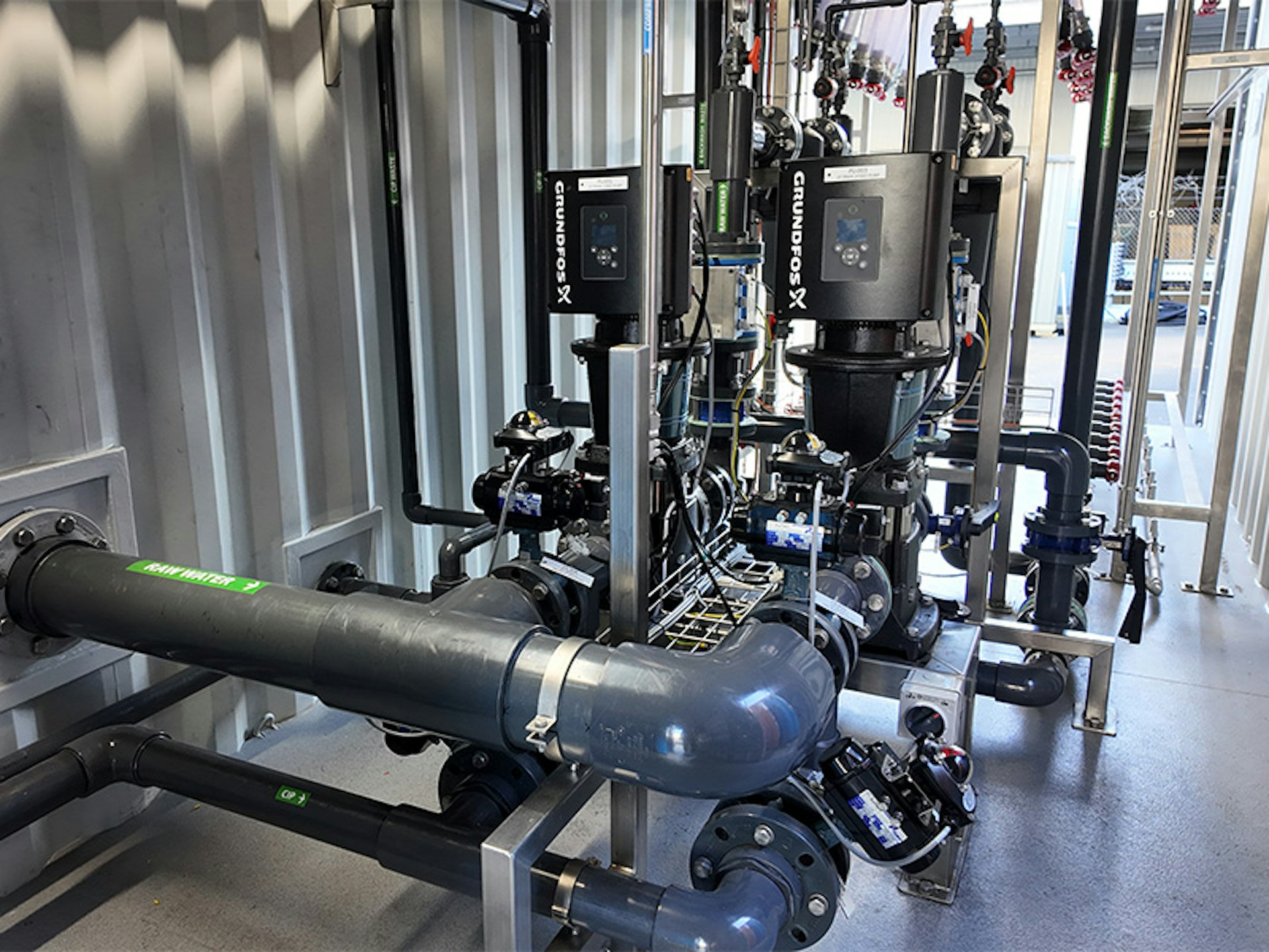 Process pumps and pipework installed within a containerised ultrafiltration plant expansion