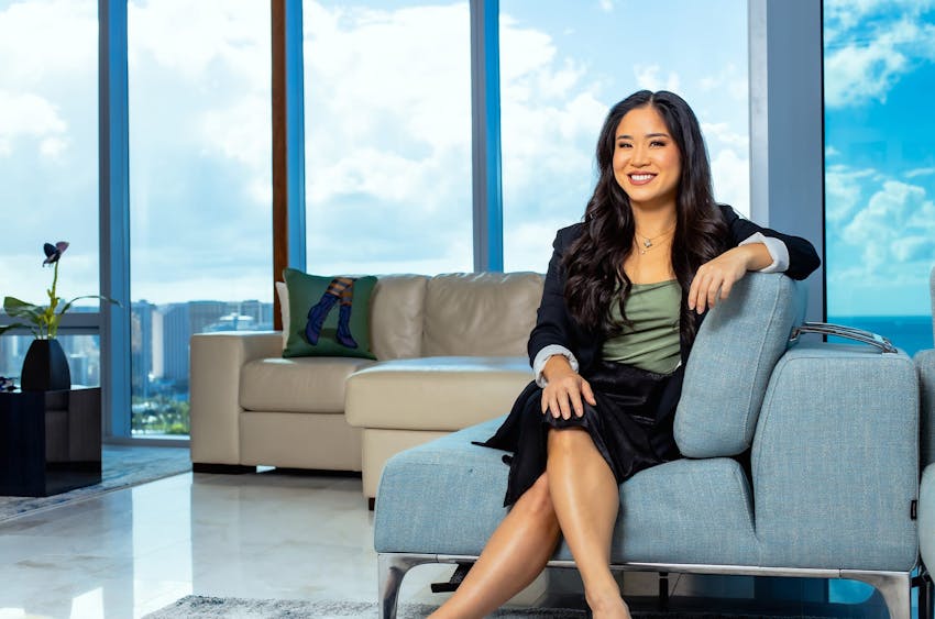 woman sitting on couch with her legs crossed