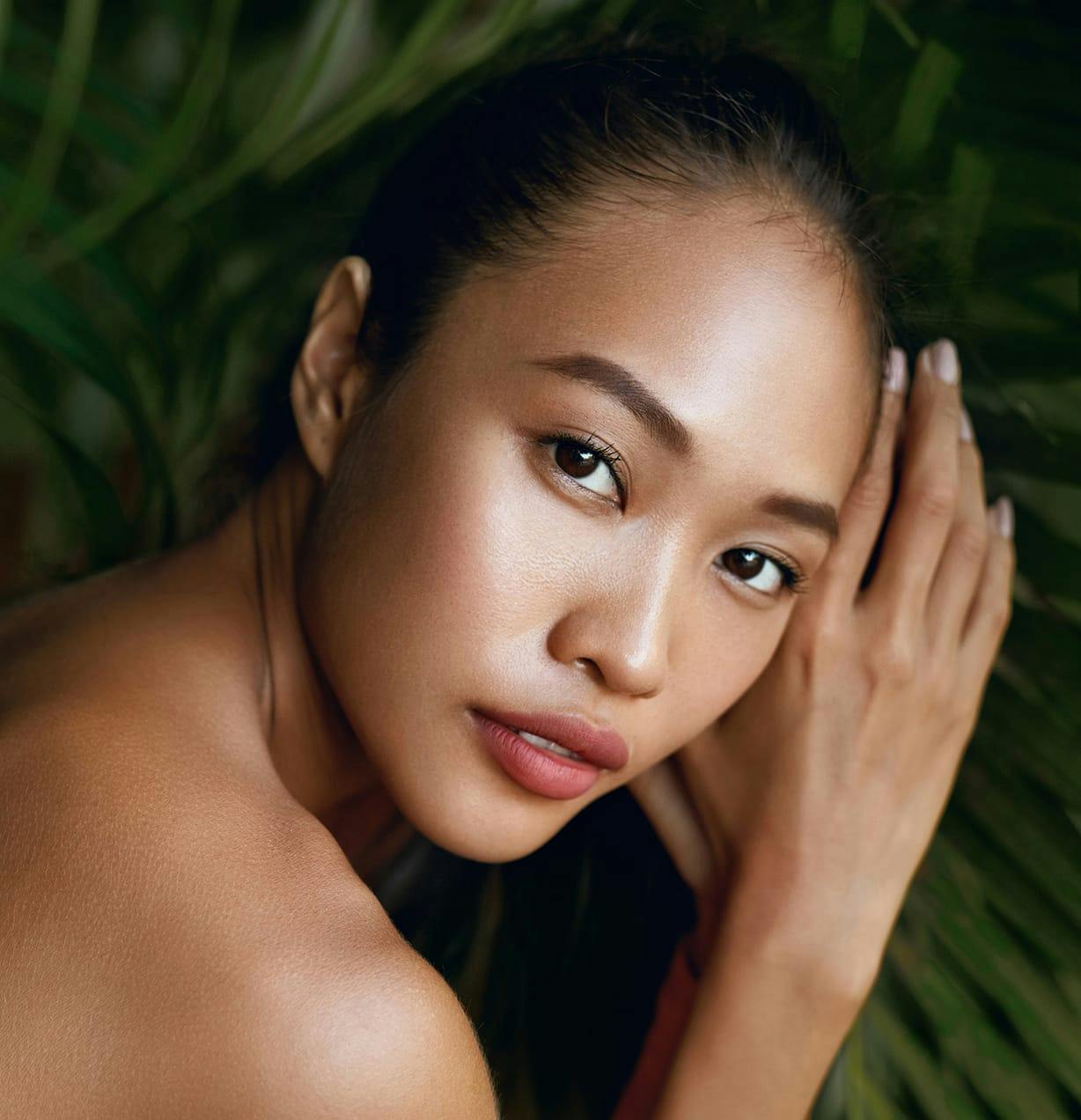 woman laying on leaves