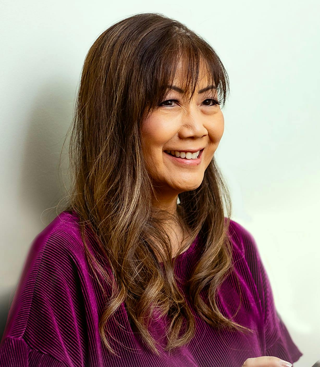 woman wearing a purple velvet shirt