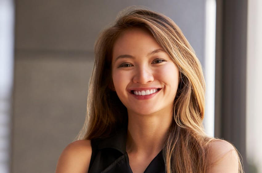woman smiling and looking at another woman