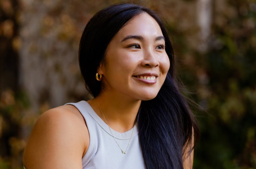 woman smiling with her hair over her shoulder