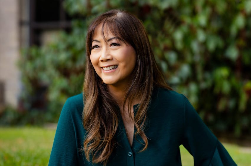 woman with bangs smiling