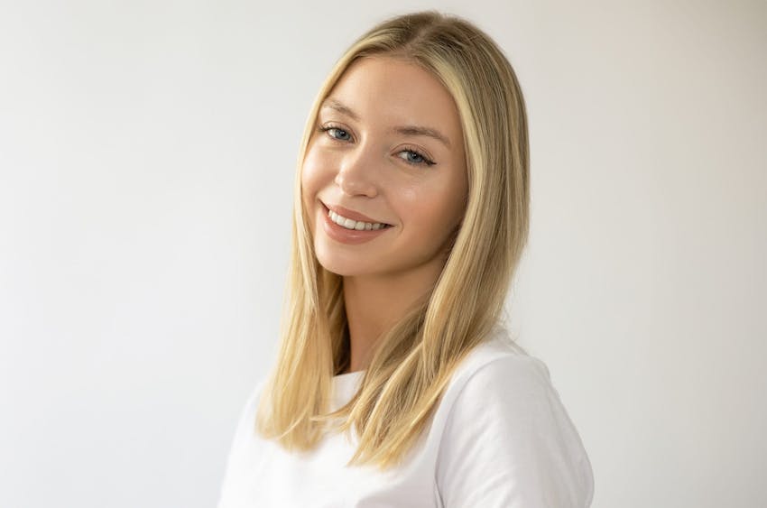 woman looking to the left with the sunlight hitting her face