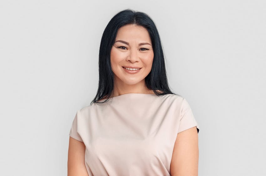 woman outdoors facing and looking to the left