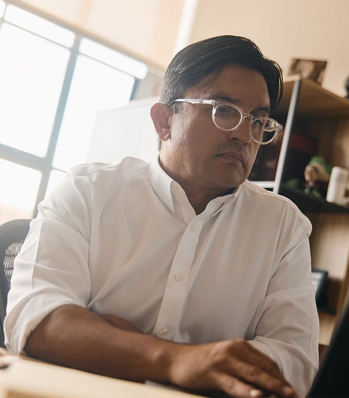 Fassold working on a computer