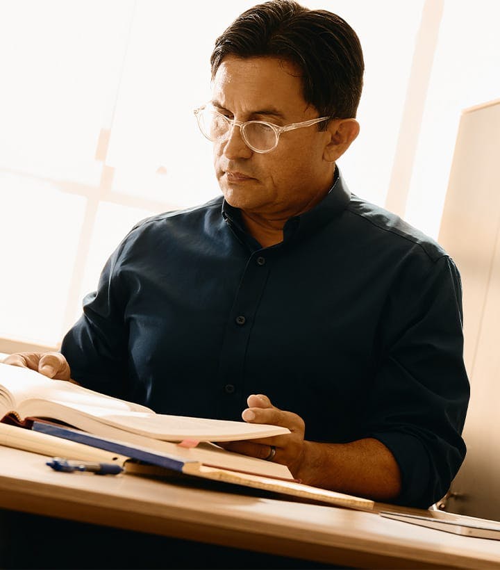 attorney looking at a law book