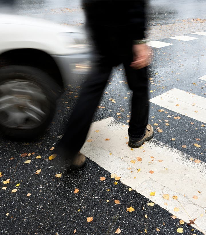 man crossing a street