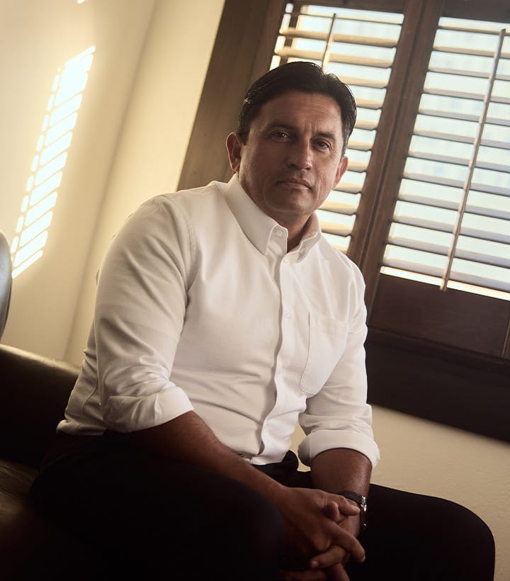 Mark A.J. Fassold sitting on a couch