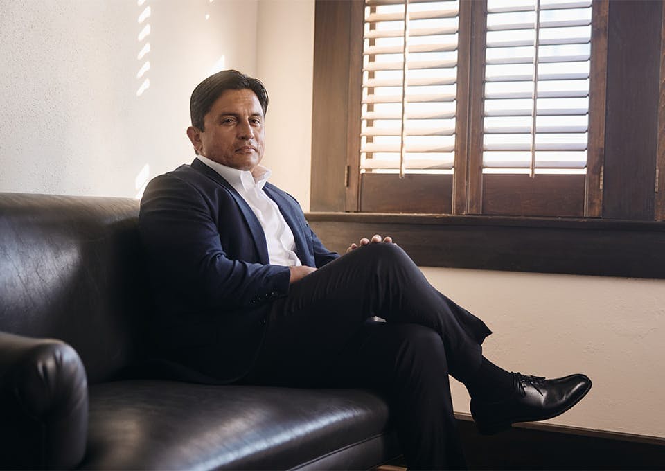 Mark A.J. Fassold sitting on a couch