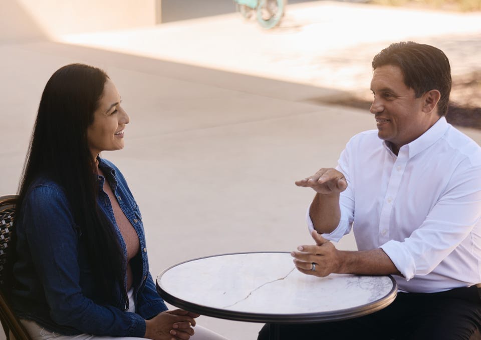Fassold talking to a woman