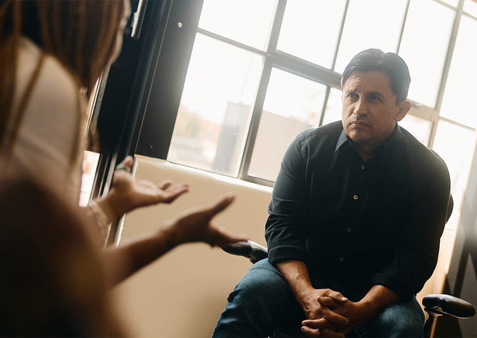 Fassold talking to a woman