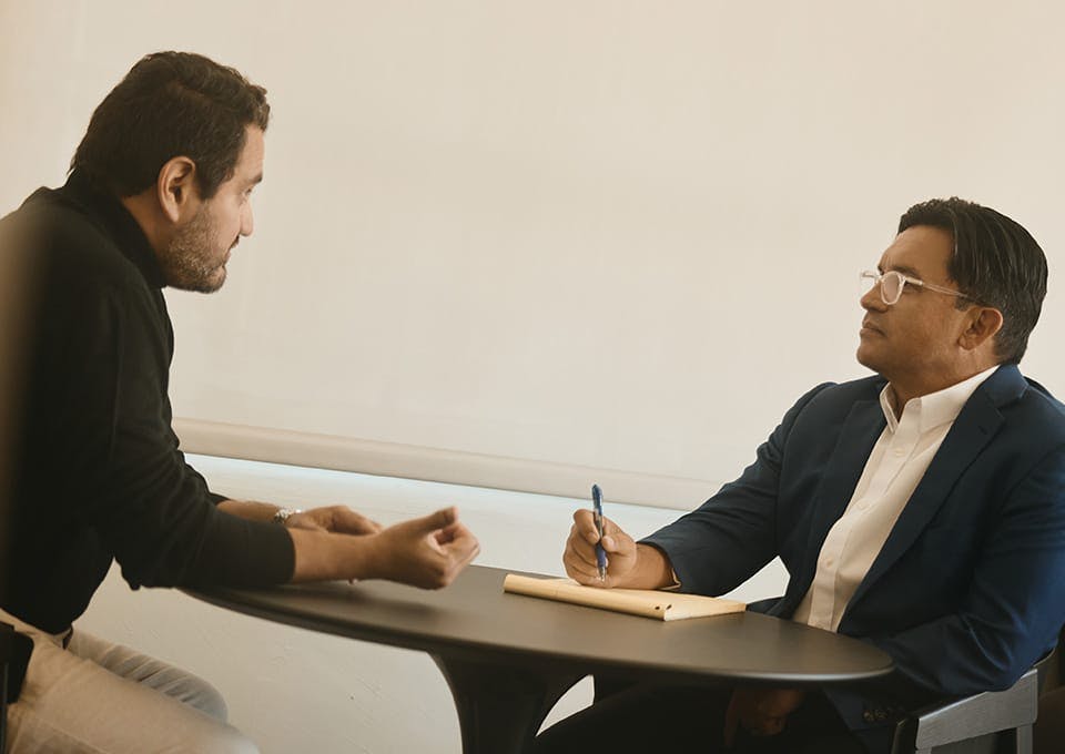Fassold talking to a client