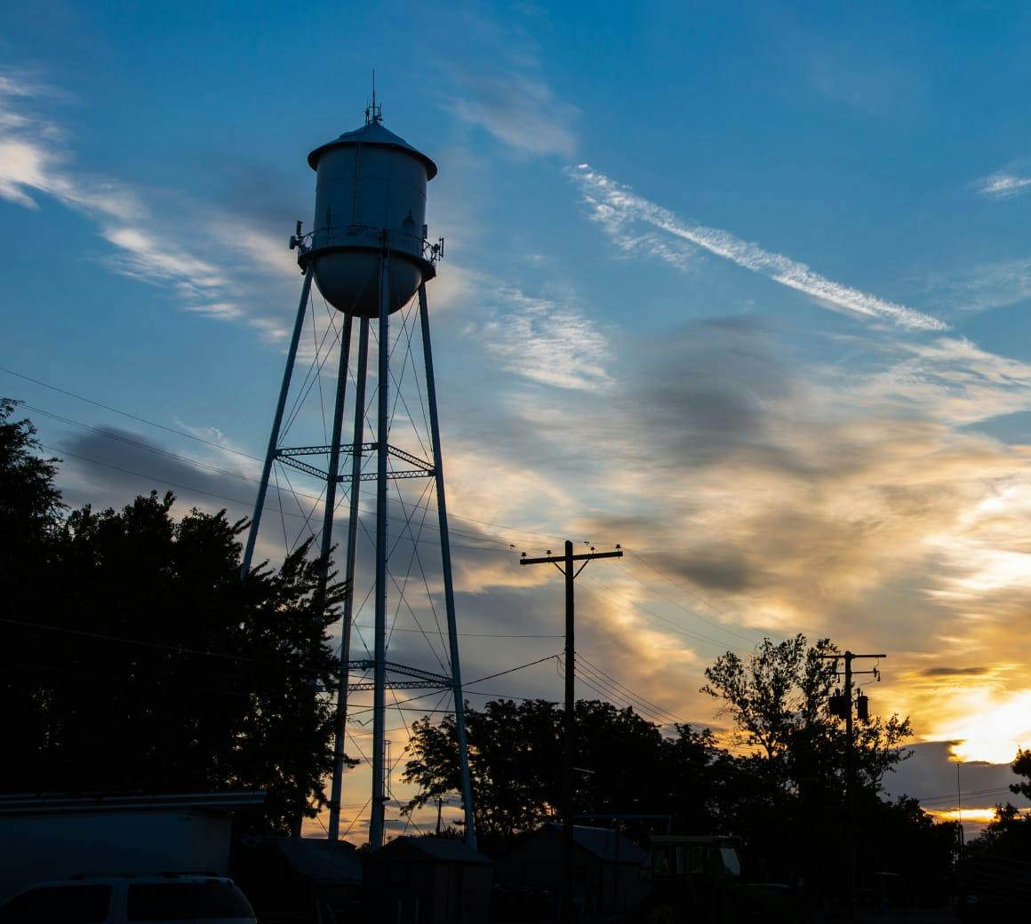 water tower at sunset