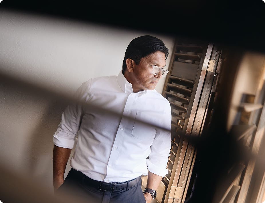 Mark Fassold through window shutters