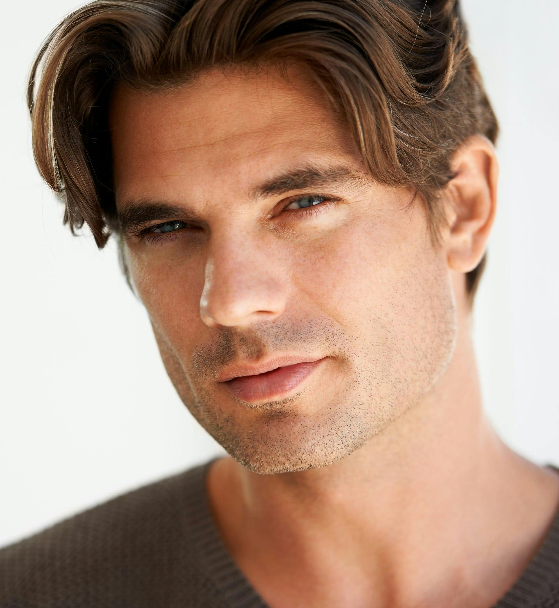 man posing and looking into lens