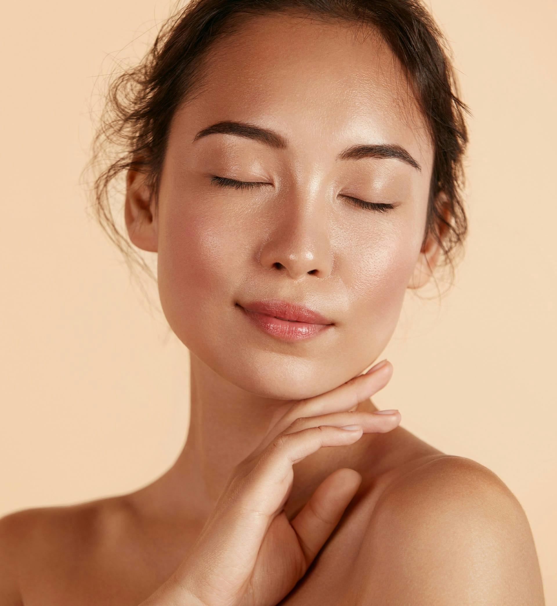 woman touching their chin