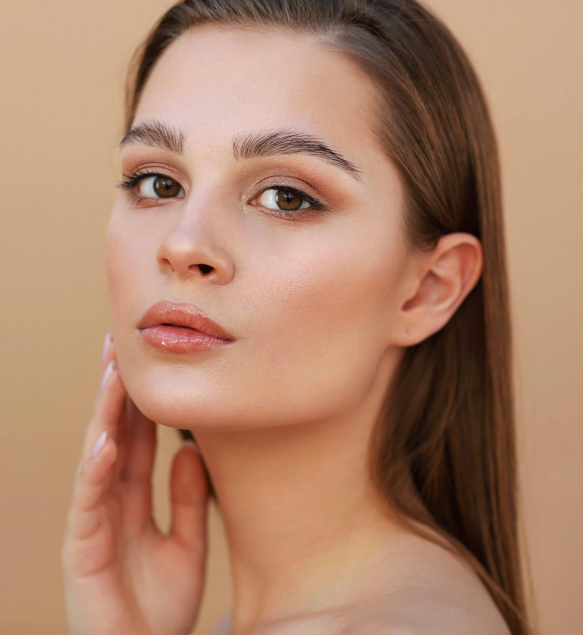 woman touching her chin