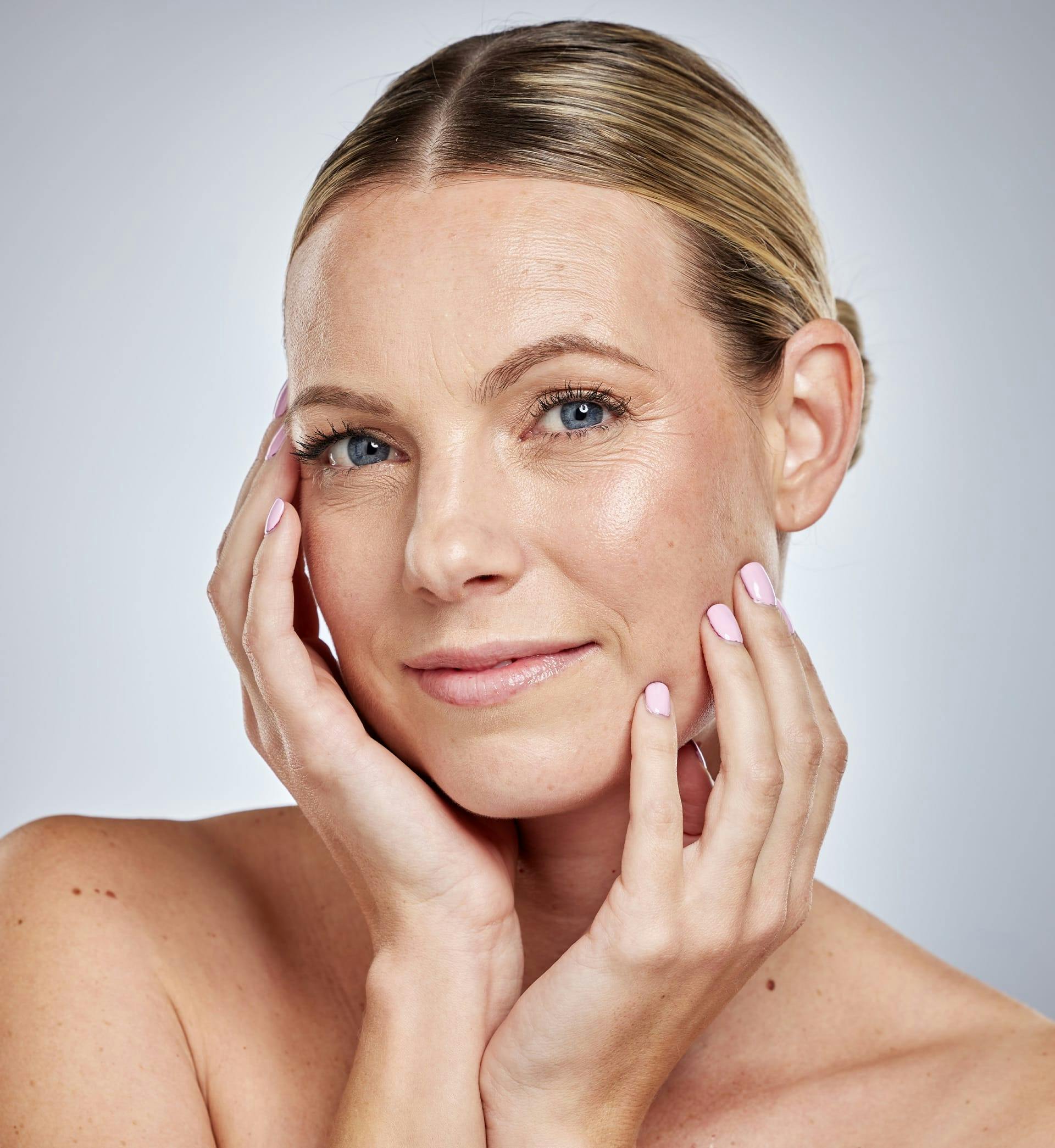 woman posing touch face