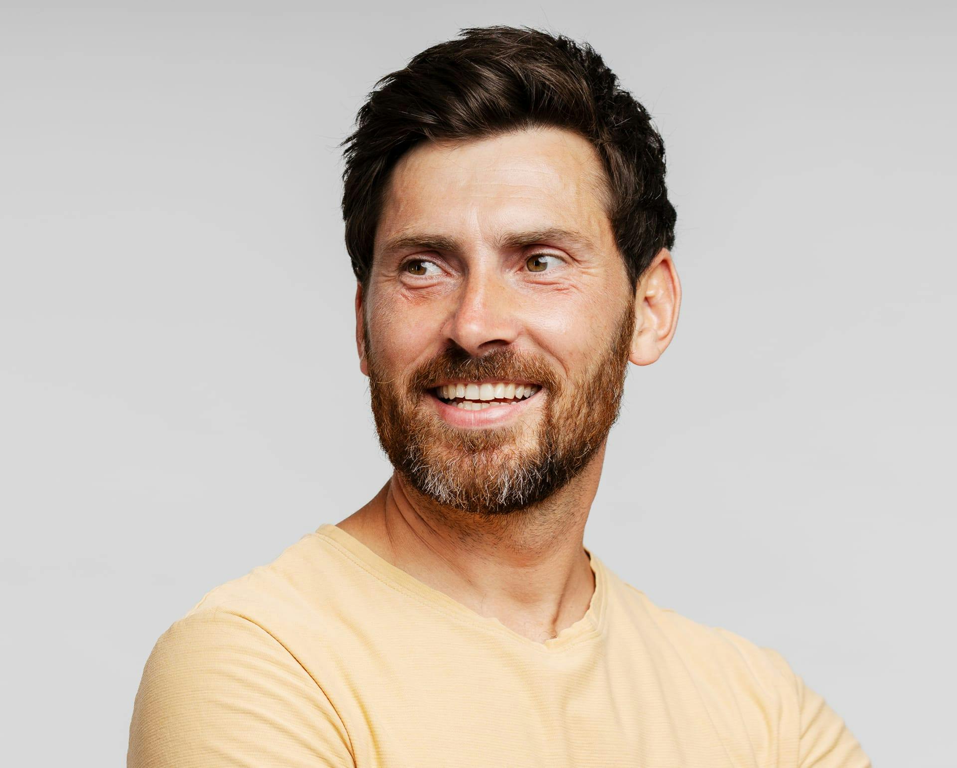 man with beard smiling