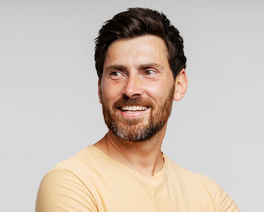 man with beard smiling