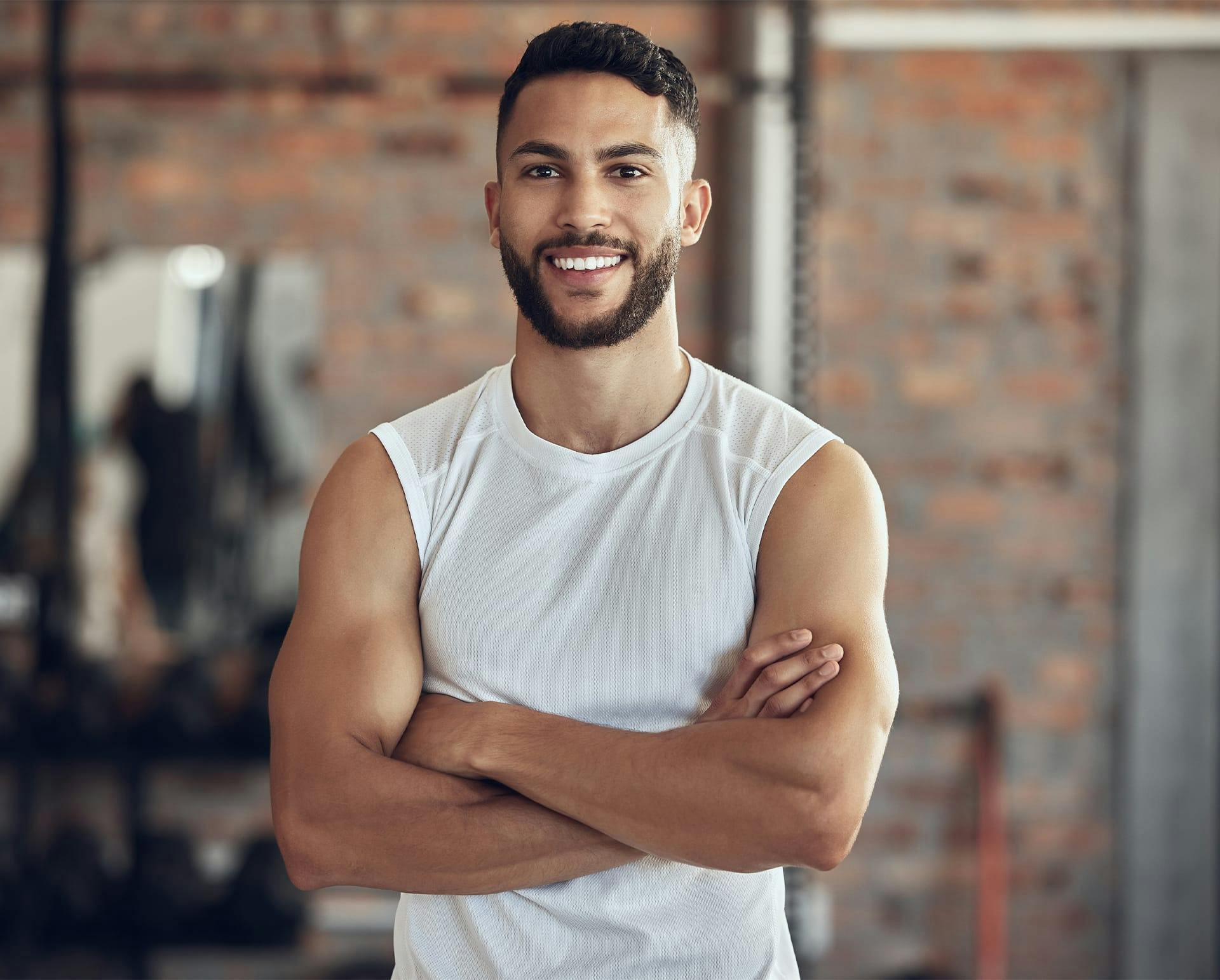 man in a white tank top
