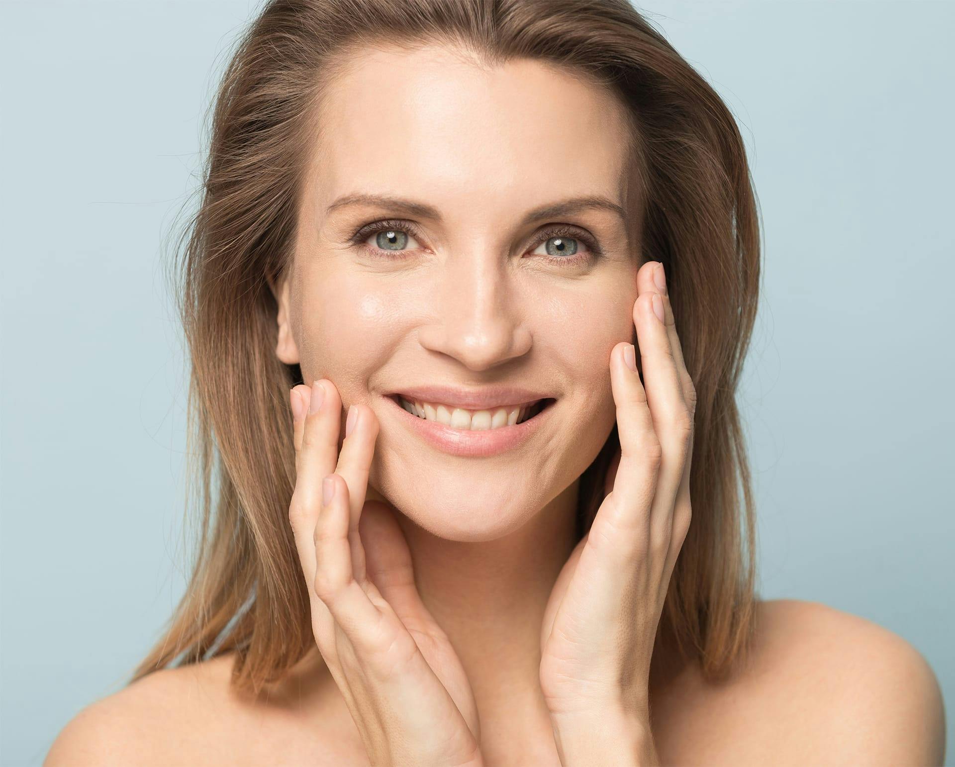 woman touching the sides of her face