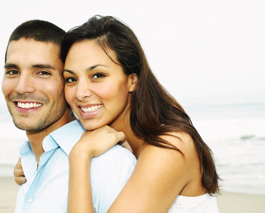 couple embracing and smiling