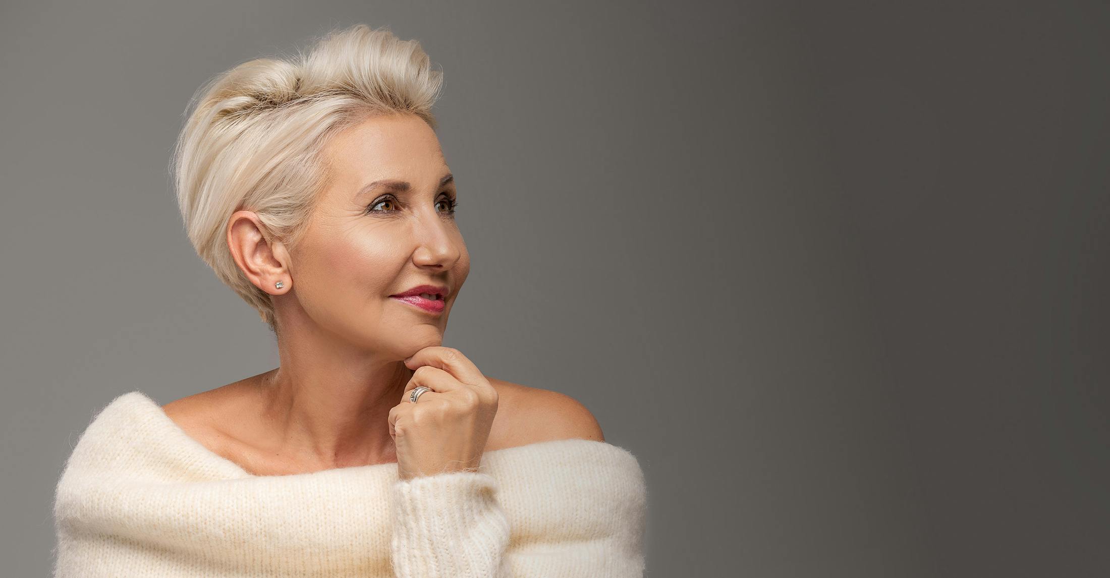 glamorous woman wearing a white sweater