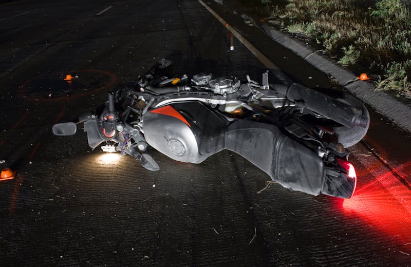 A motorcycle laying on its side