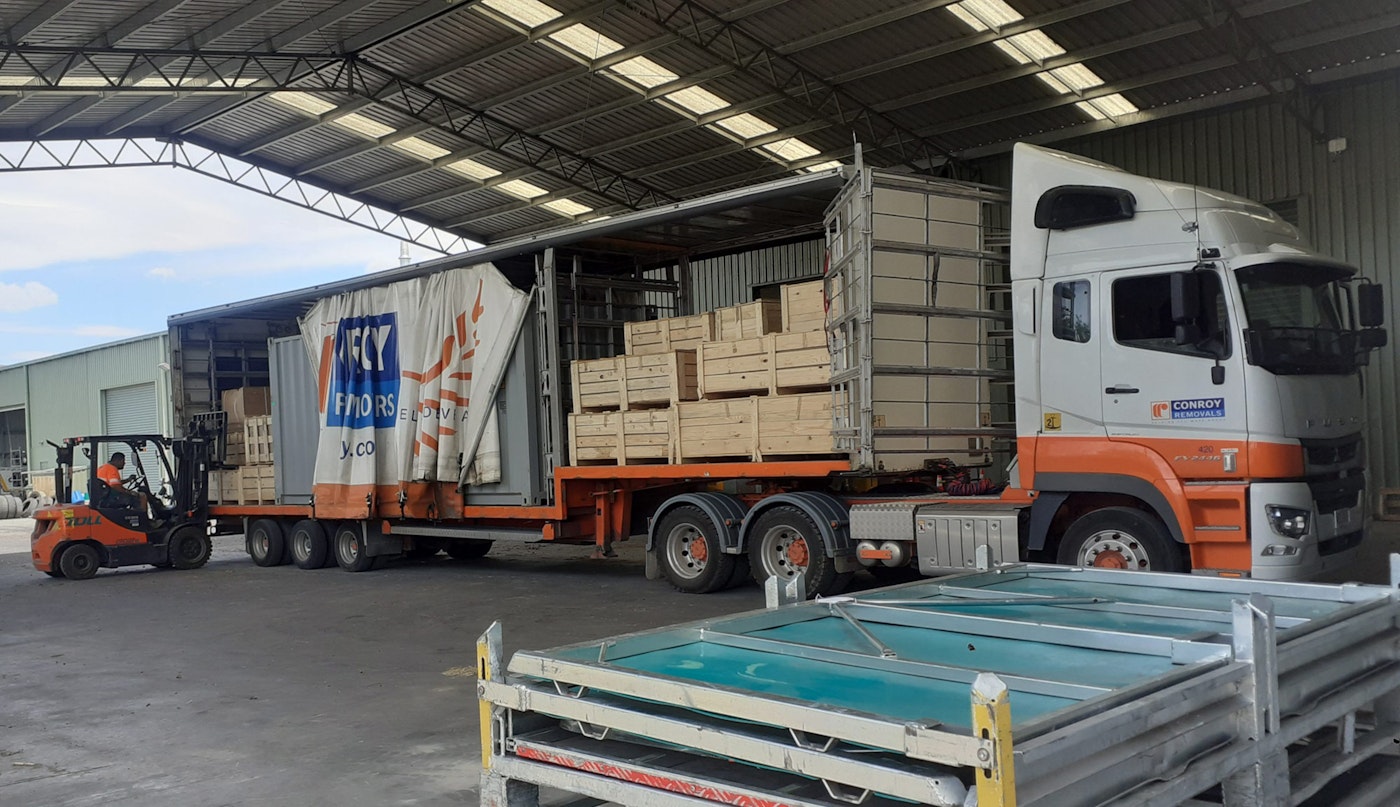 Conroy Removals' FUSO Shogun 6x4 curtainsider from Keith Andrews being loaded.
