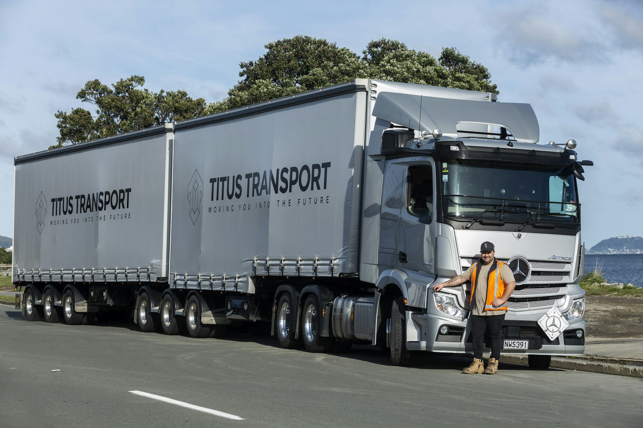 Richie Belvie next to a 6x4 Mercedes-Benz Actros Curtainsider from Keith Andrews.