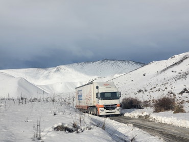 Conroy Removals' FUSO Shogun 6x4 curtainsider from Keith Andrews in snow.