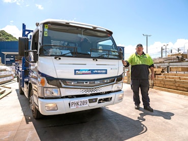 Jason Fisk of PlaceMakers beside FUSO eCanter tipper from Keith Andrews.